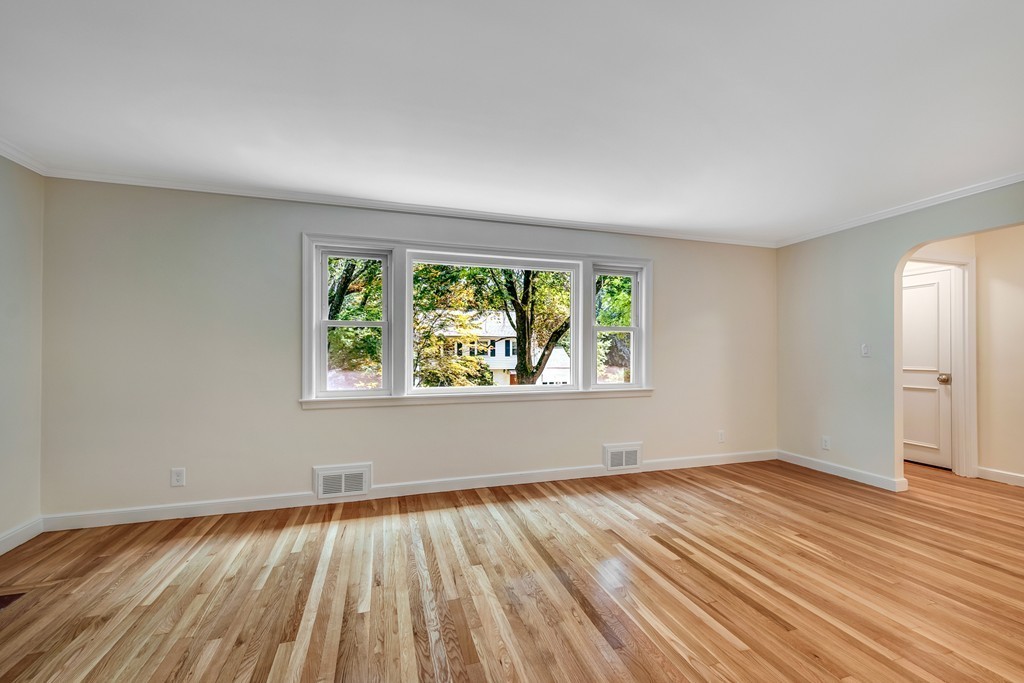 43 Kendall Road Newton, MA 02459 - Photo 5 of 22 an empty room with wooden floor and windows