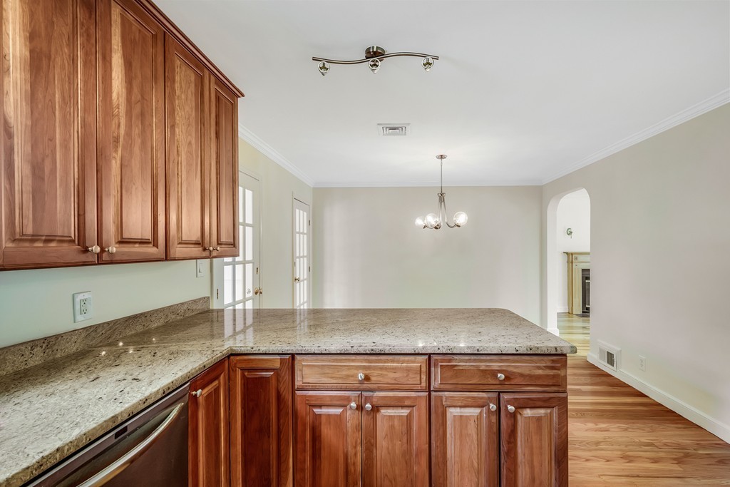 43 Kendall Road Newton, MA 02459 - Photo 9 of 22 a kitchen with a sink a counter top space and cabinets