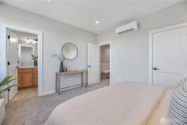 a bedroom with a bed and a dresser