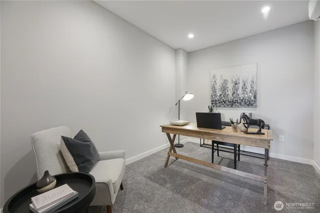 a view of a workspace with furniture