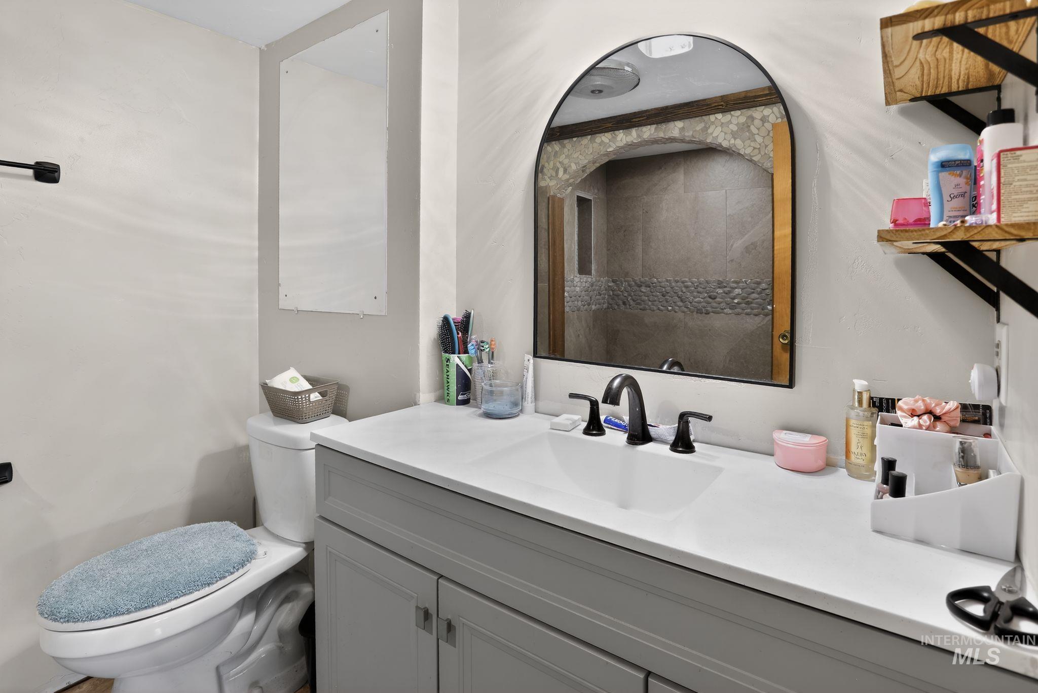 654 Bings Road Cascade, ID 83611 - Photo 22 of 45 Bathroom featuring vanity and a tile shower