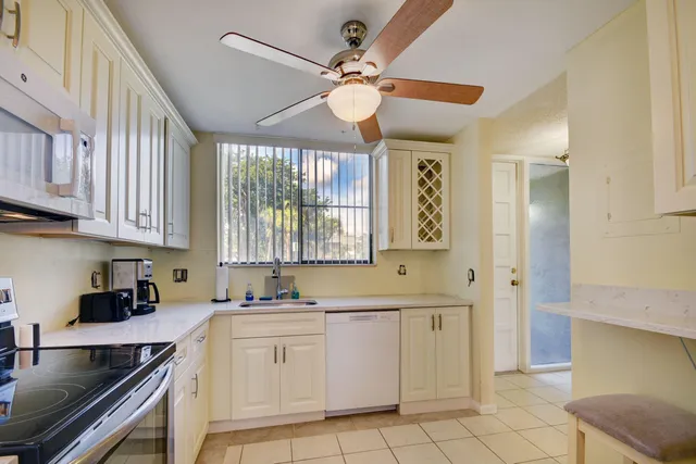 a kitchen with cabinets a sink and a stove