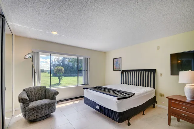 a bedroom with a bed and a desk