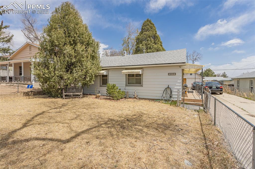 1105 Prairie Road Colorado Springs, CO 80909 - Photo 2 of 24 a view of a backyard of the house