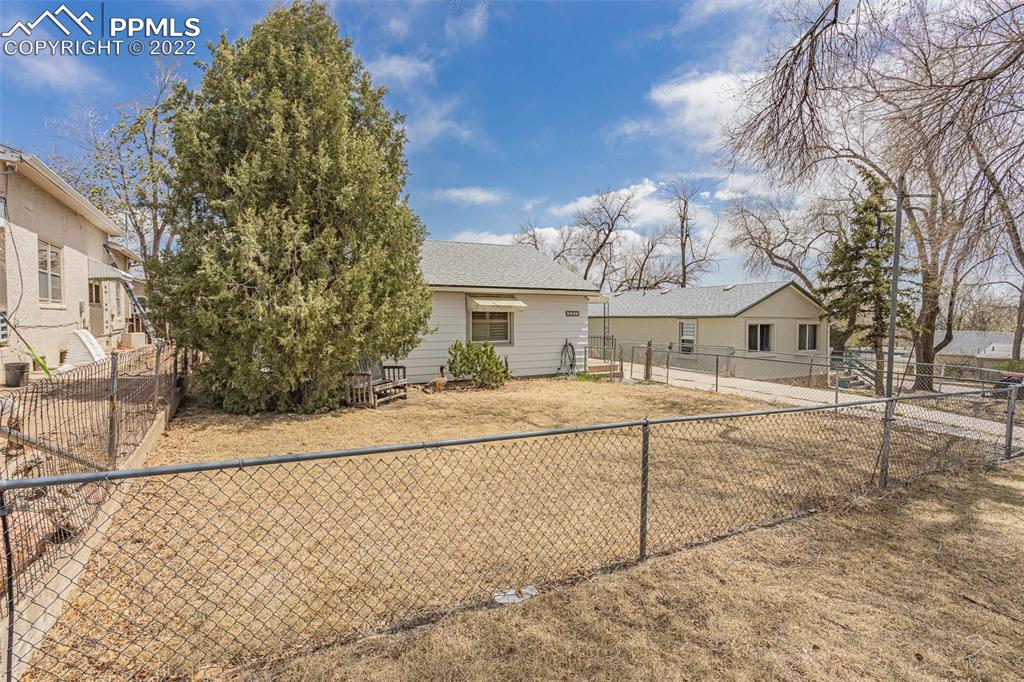 1105 Prairie Road Colorado Springs, CO 80909 - Photo 3 of 24 a view of house with street