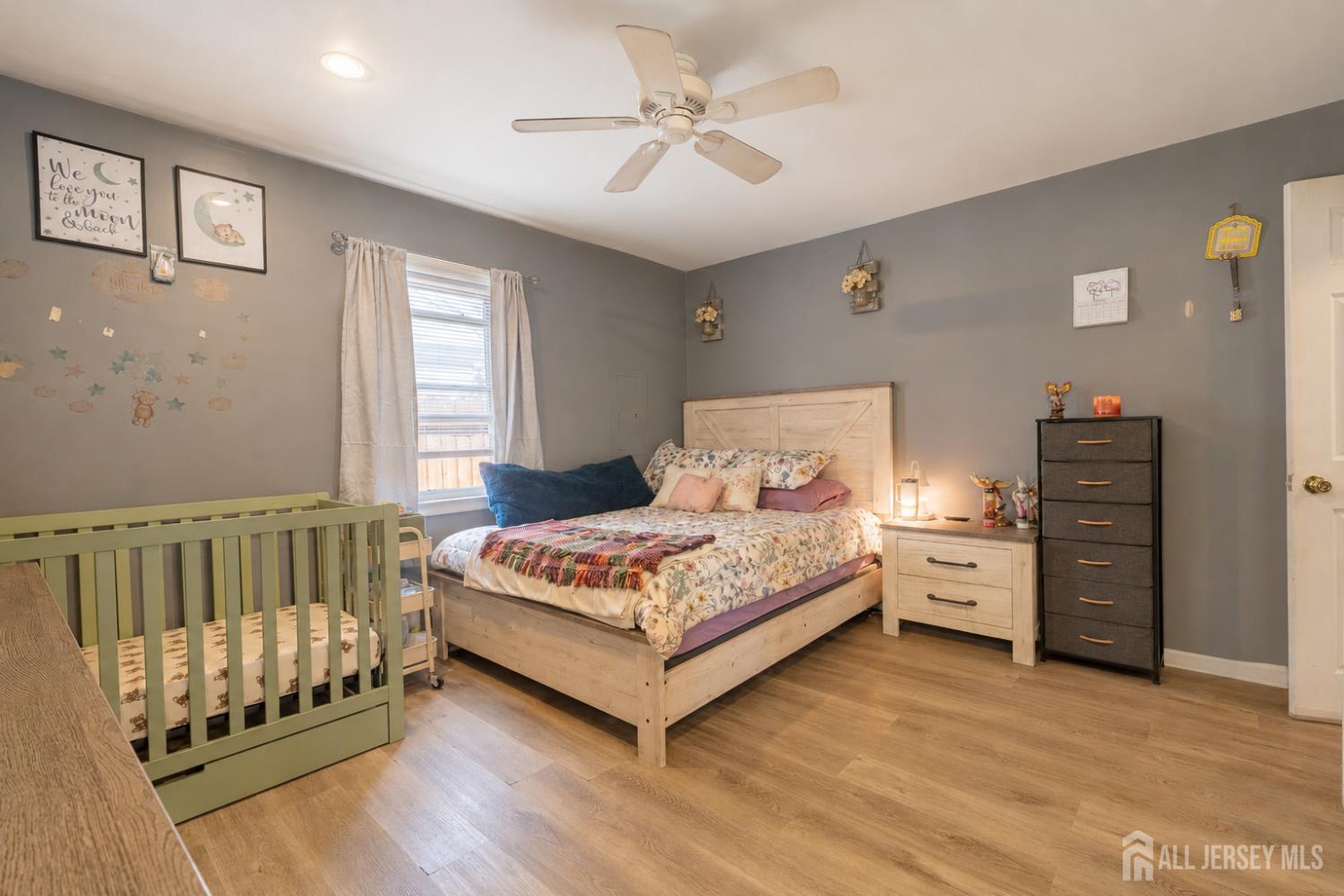 12 Pierrepont Avenue Middlesex, NJ 08846 - Photo 13 of 30 a bedroom with a bed and a chandelier