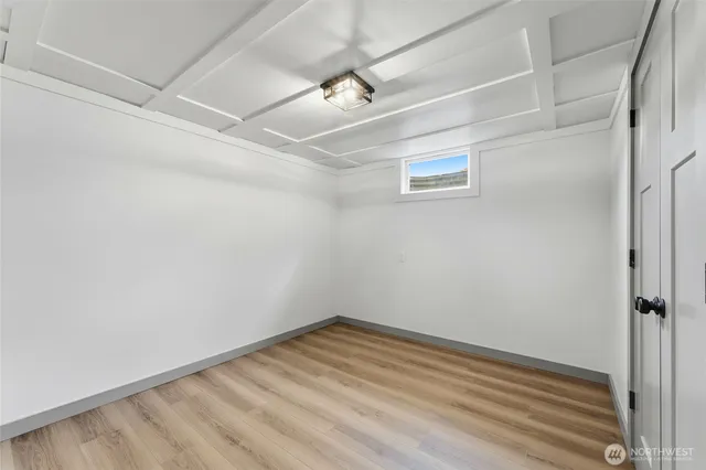 a view of a room with wooden floor
