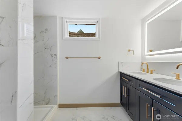 a view of a bathroom with double vanity sink