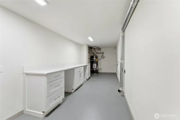 a view of walk in closet with cabinets