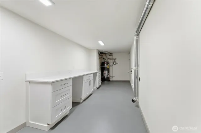a view of walk in closet with cabinets