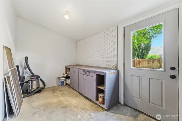 a view of a storage & utility room with washer and dryer