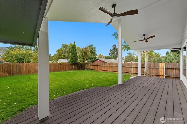 a view of a backyard with wooden floor