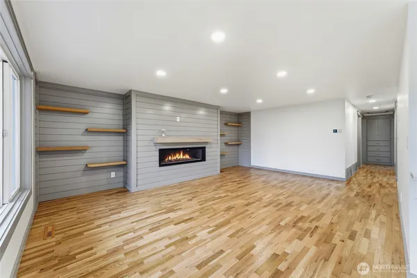 a view of an empty room and a fireplace