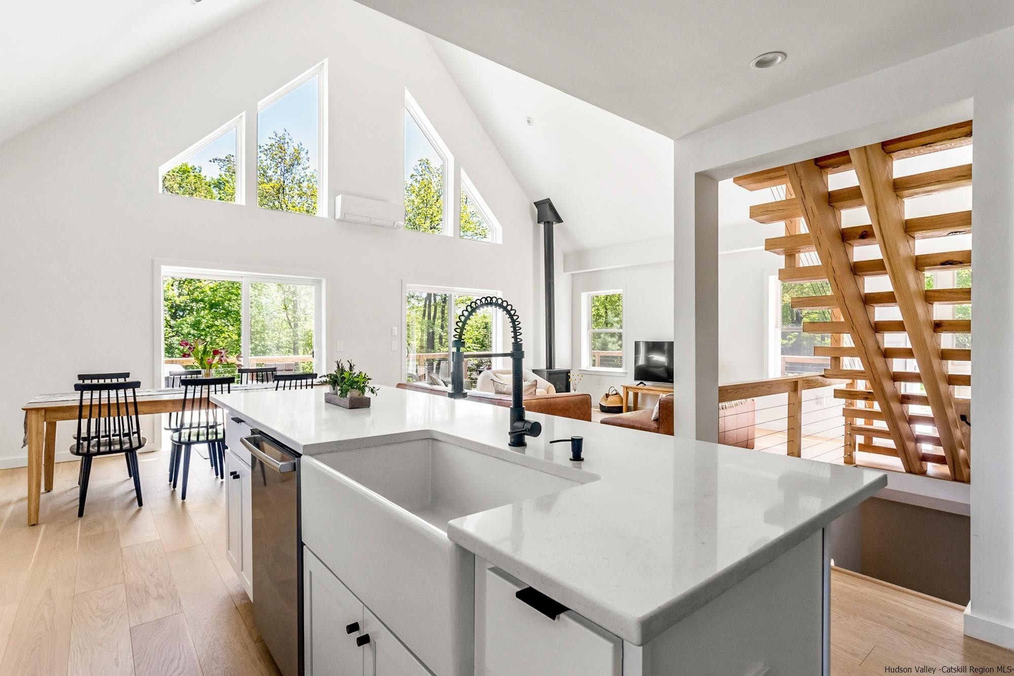 17 Freeman Avery Road Olivebridge, NY 12461 - Photo 16 of 32 a kitchen with a stove a sink and a dining table with garden view