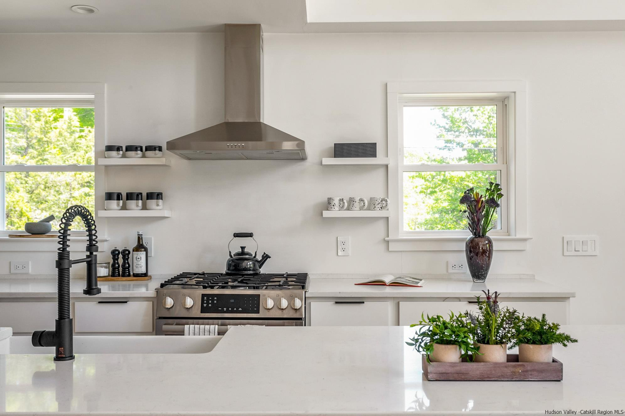 17 Freeman Avery Road Olivebridge, NY 12461 - Photo 17 of 32 a kitchen with stainless steel appliances a white table and a stove