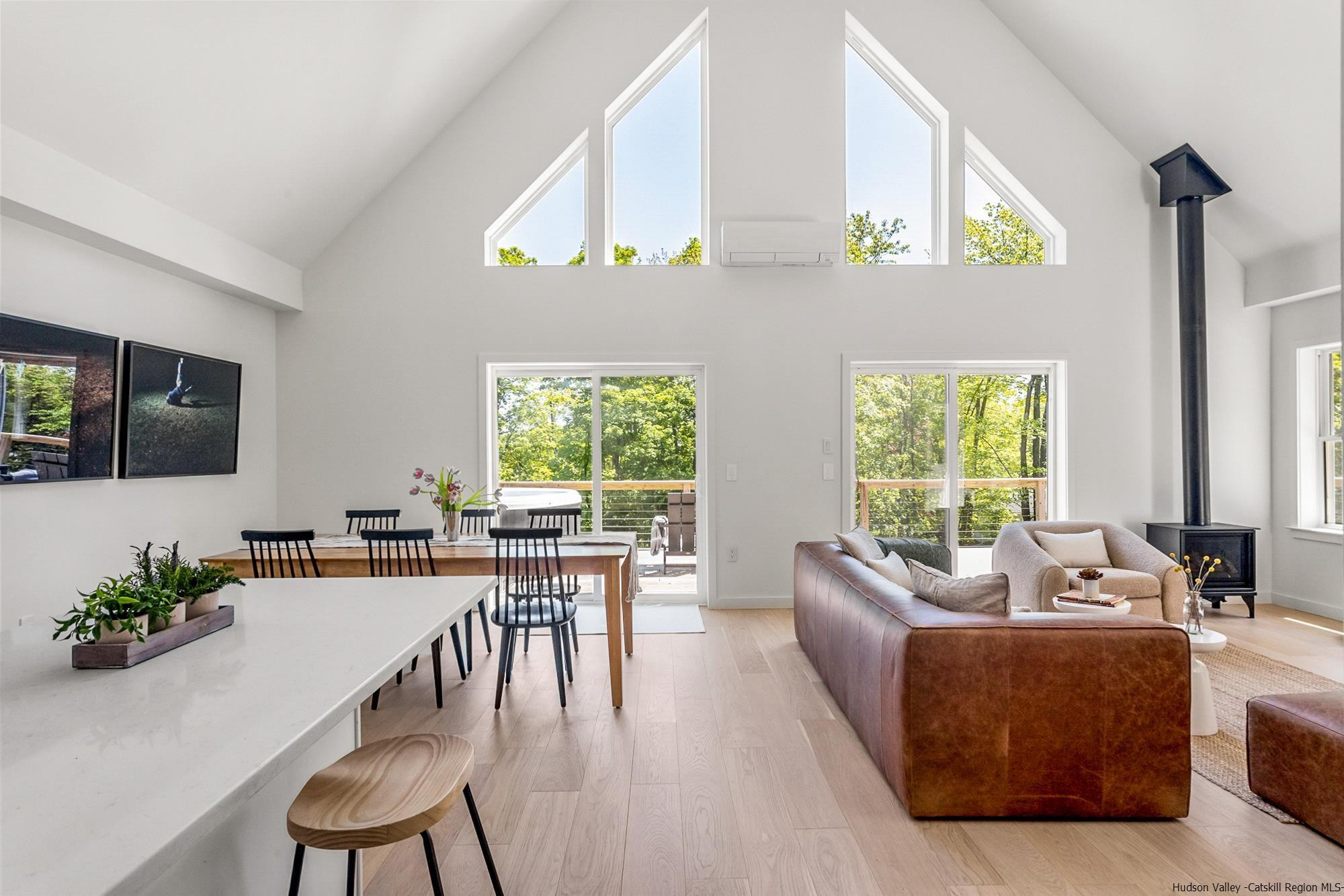 17 Freeman Avery Road Olivebridge, NY 12461 - Photo 2 of 32 a living room with furniture a large window and a flat screen tv