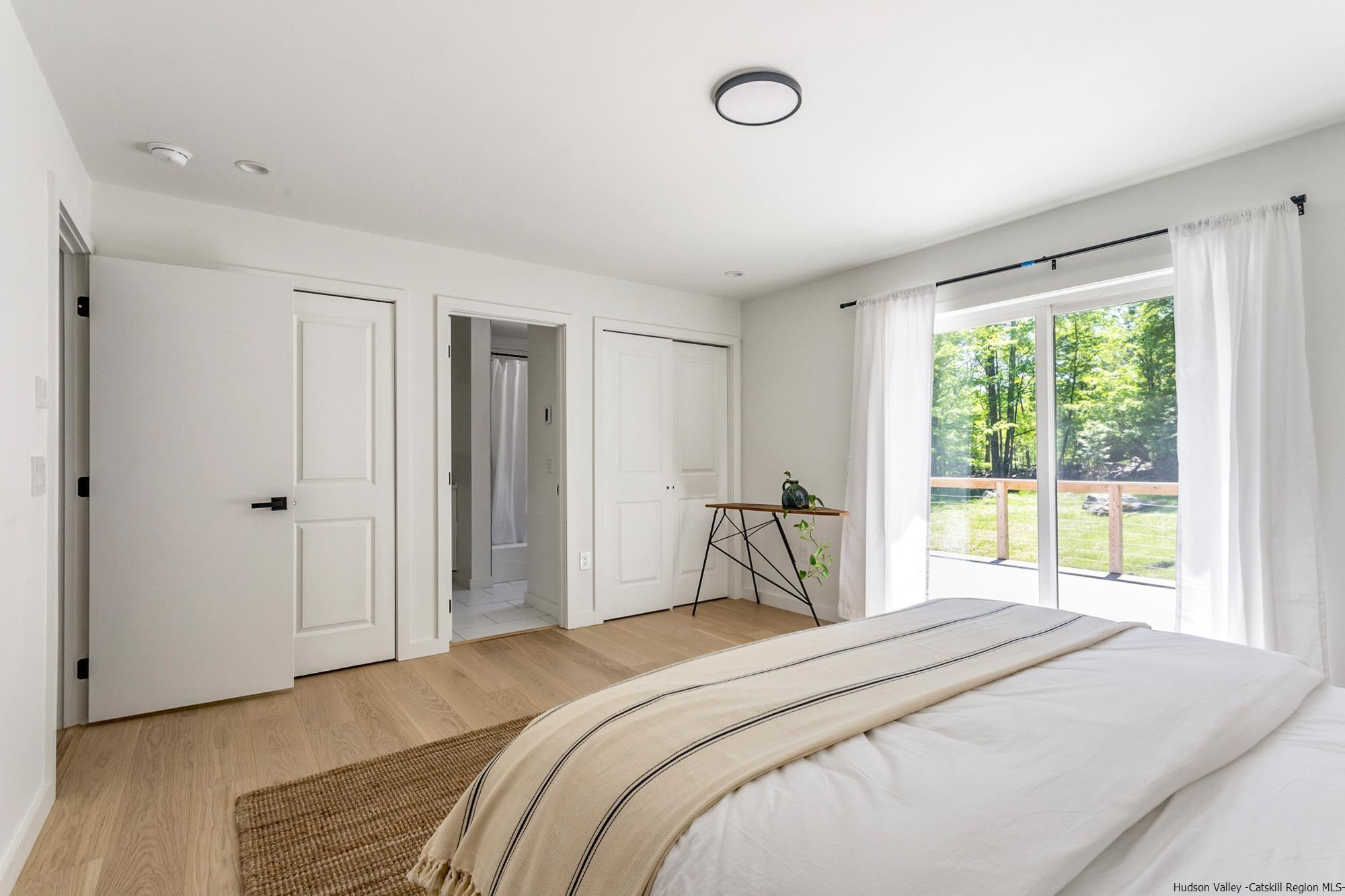 17 Freeman Avery Road Olivebridge, NY 12461 - Photo 22 of 32 a bedroom with a bed and a large window