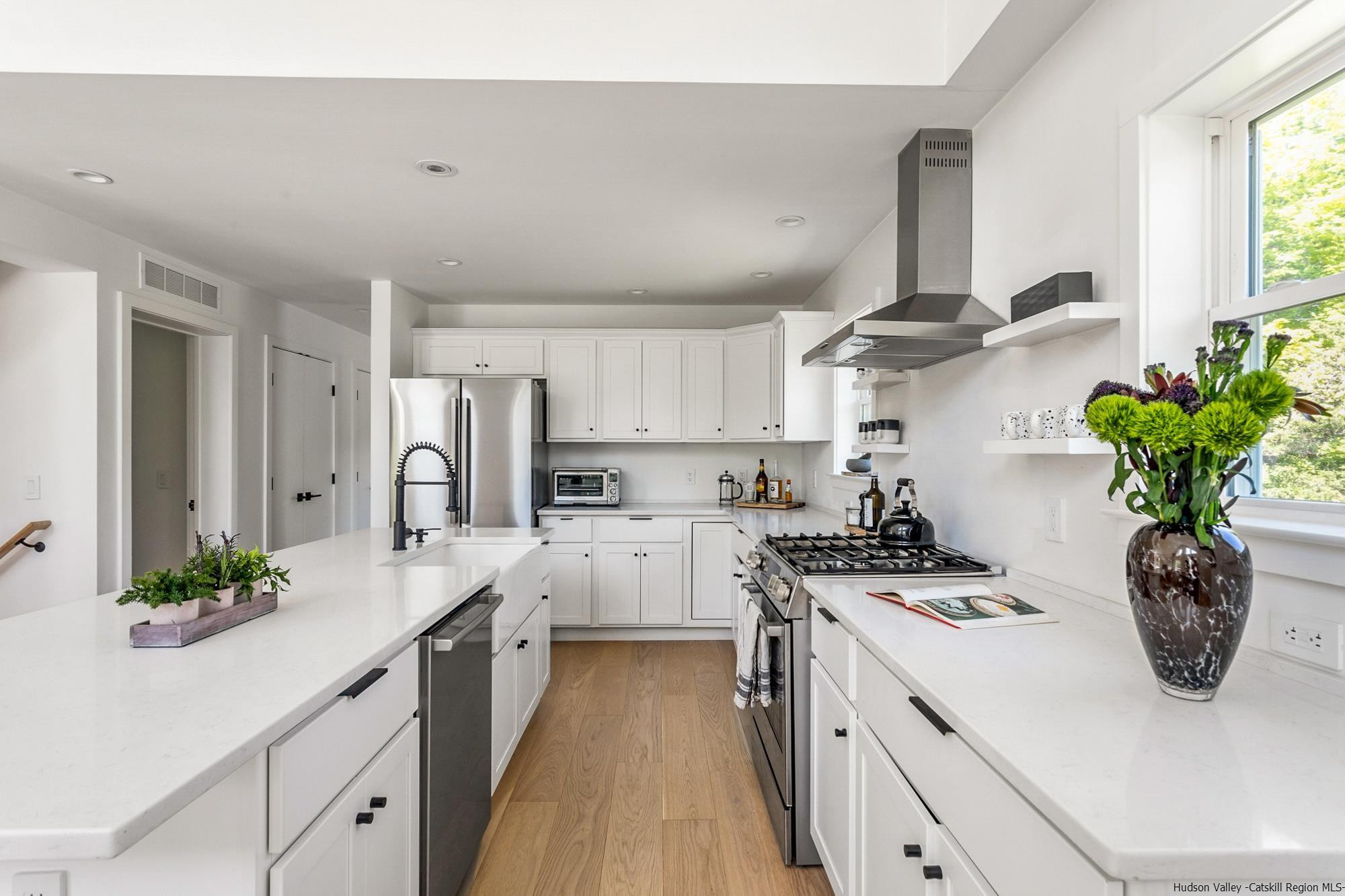 17 Freeman Avery Road Olivebridge, NY 12461 - Photo 4 of 32 a kitchen with stainless steel appliances a sink a stove and white cabinets