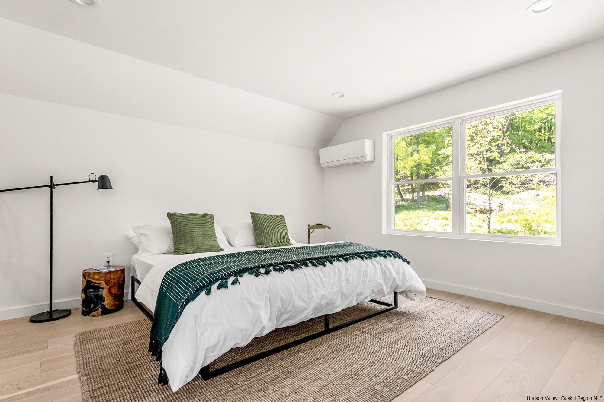 17 Freeman Avery Road Olivebridge, NY 12461 - Photo 6 of 32 a large bed sitting in a bedroom next to a window