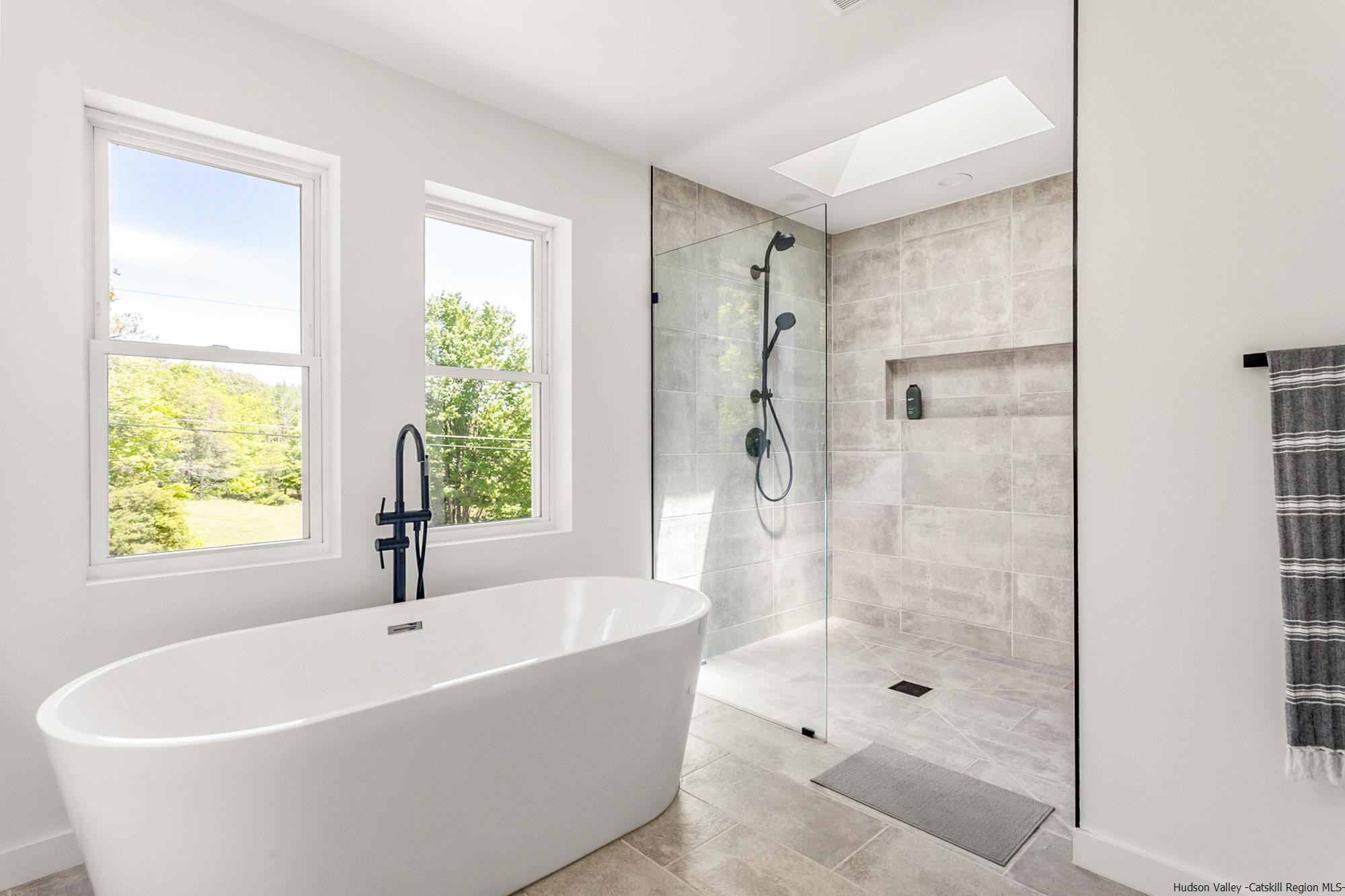 17 Freeman Avery Road Olivebridge, NY 12461 - Photo 7 of 32 a white bath tub sitting next to a shower