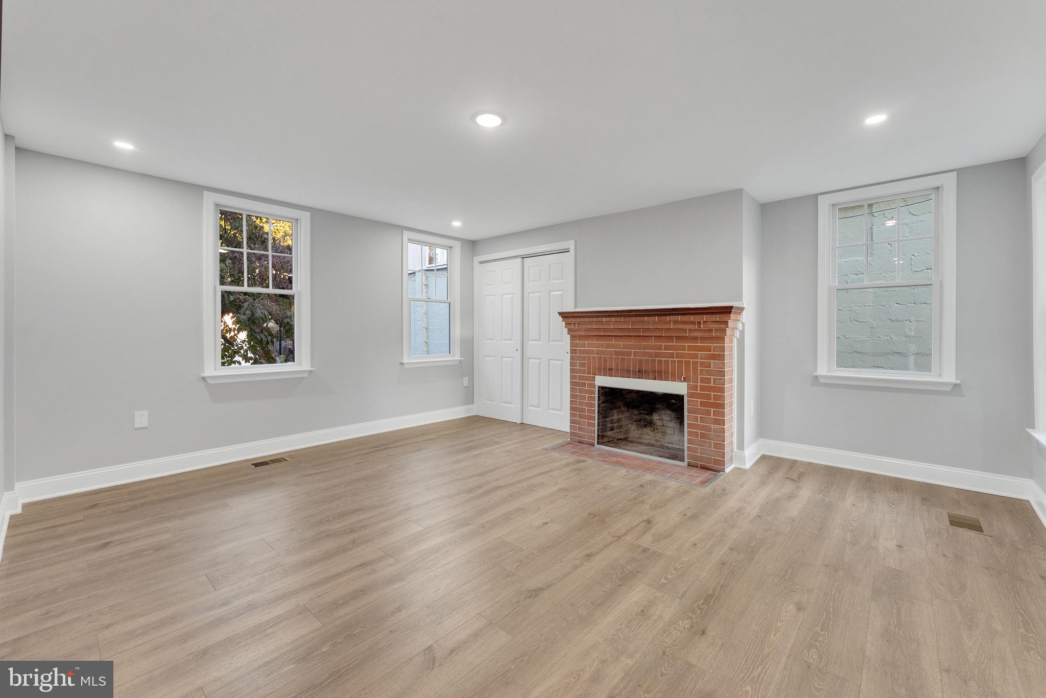 15 North Main Street, Unit A Pennington, NJ 08534 - Photo 5 of 9 a view of an empty room with a window and fireplace