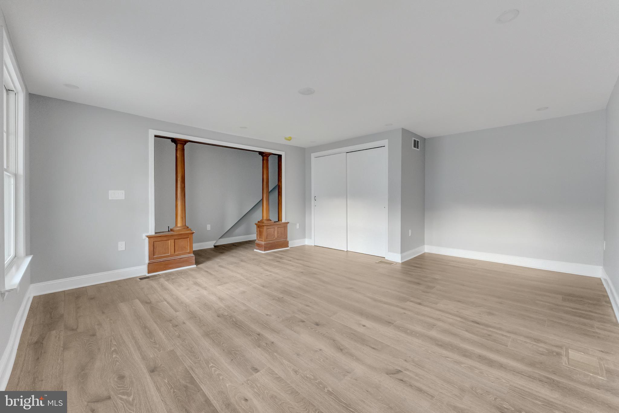 15 North Main Street, Unit A Pennington, NJ 08534 - Photo 6 of 9 a view of an empty room with wooden floor and a window
