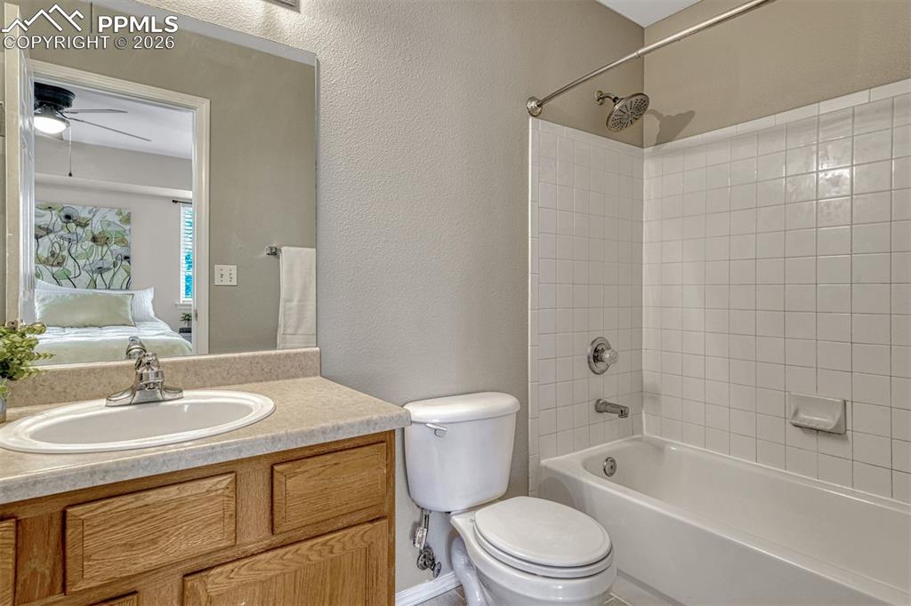 2580 Malpaso Point Colorado Springs, CO 80922 - Photo 12 of 23 a bathroom with a sink a toilet and shower