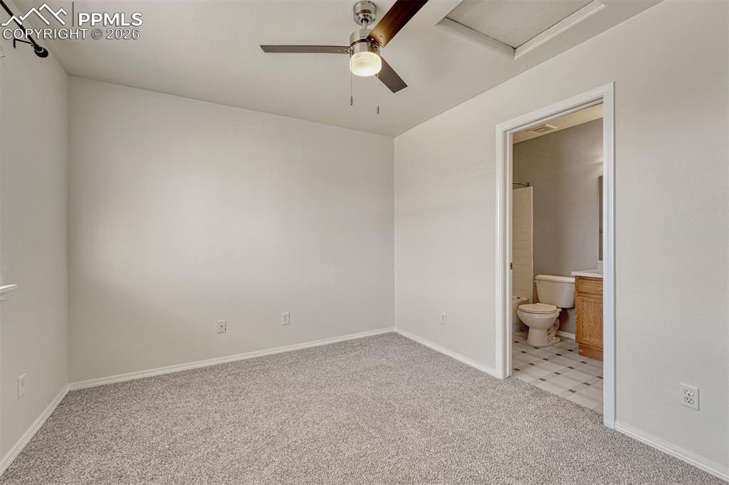 2580 Malpaso Point Colorado Springs, CO 80922 - Photo 14 of 23 an empty room and a bathroom