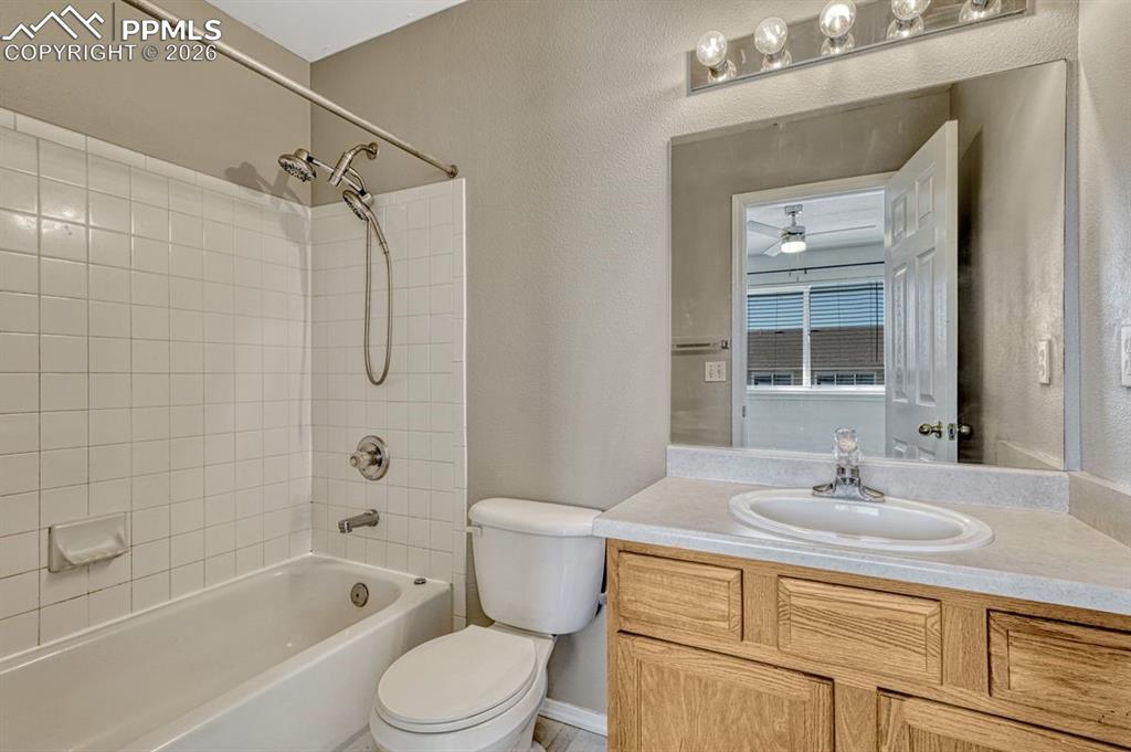 2580 Malpaso Point Colorado Springs, CO 80922 - Photo 15 of 23 a bathroom with a sink a toilet and shower