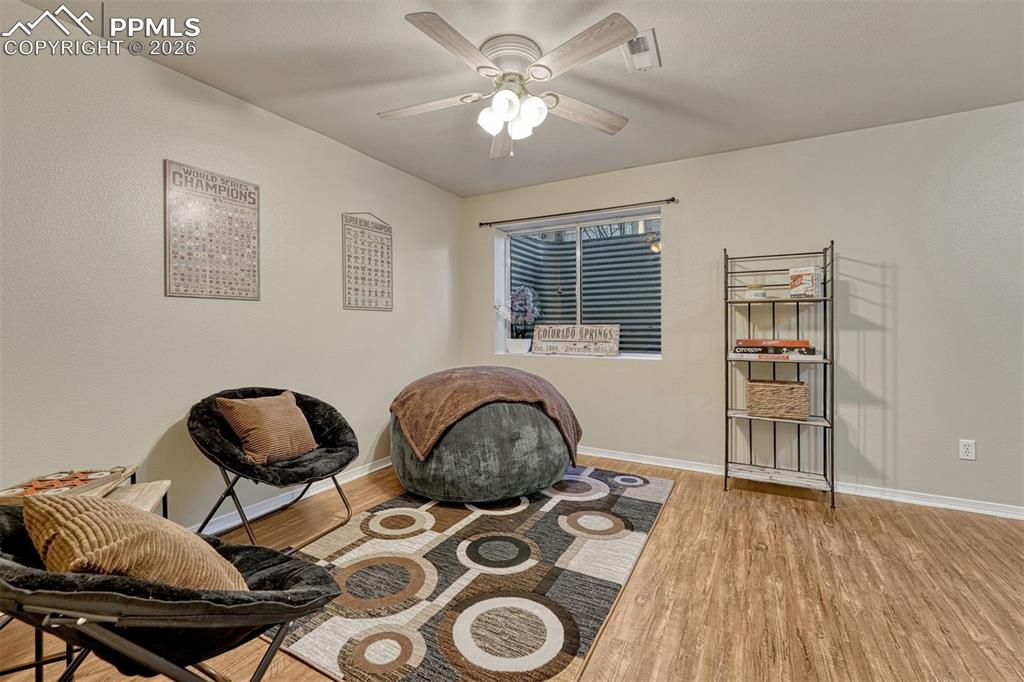 2580 Malpaso Point Colorado Springs, CO 80922 - Photo 17 of 23 a bedroom with furniture and a window