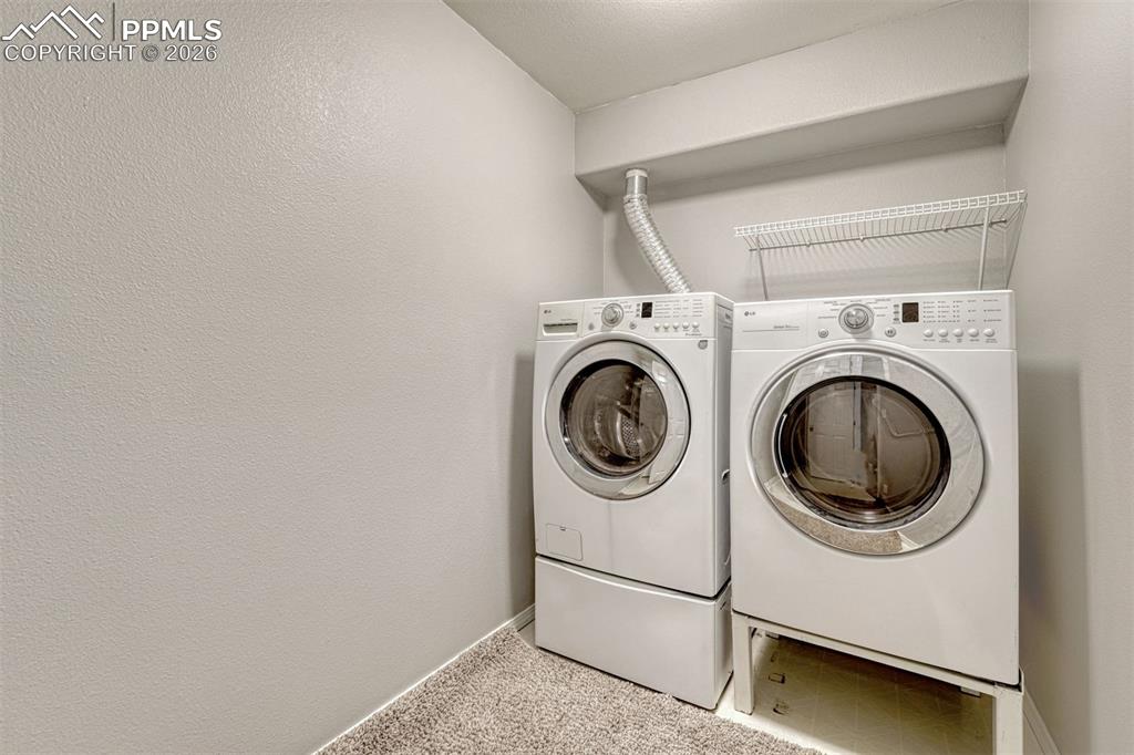 2580 Malpaso Point Colorado Springs, CO 80922 - Photo 20 of 23 a utility room with dryer and washer