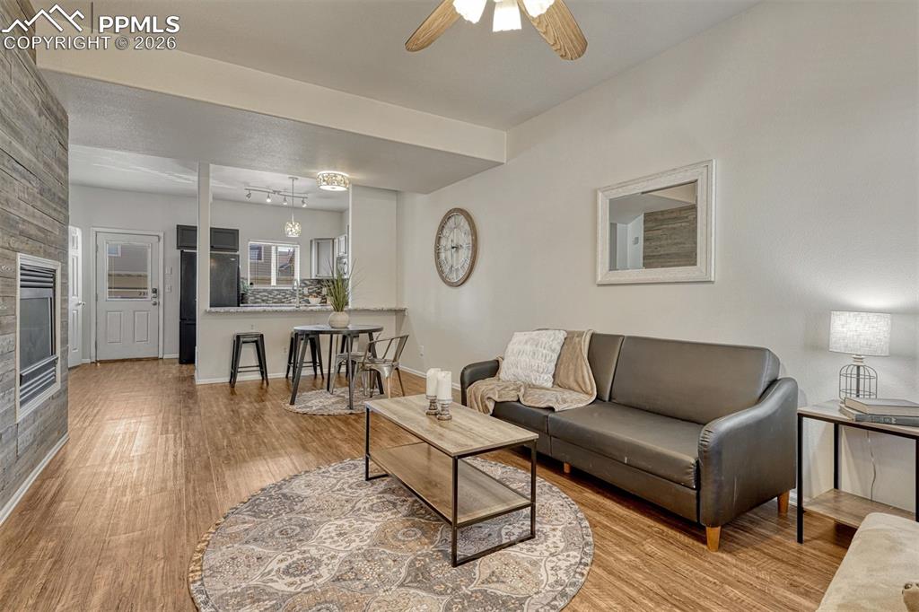 2580 Malpaso Point Colorado Springs, CO 80922 - Photo 4 of 23 a living room with furniture and wooden floor