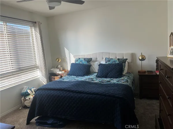 a bedroom with furniture and a window