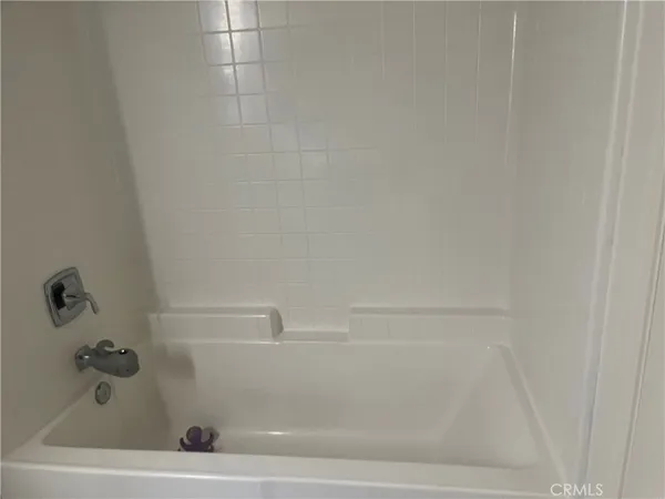a bathroom with a shower sink and mirror