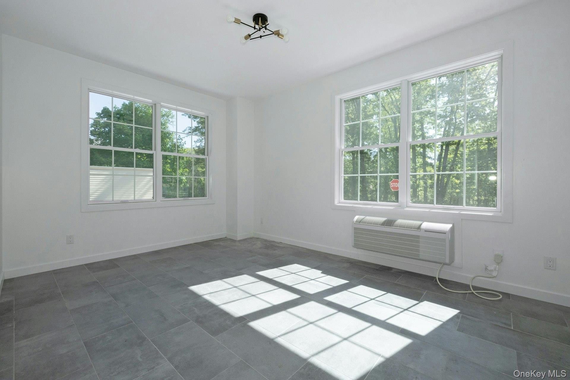 962 Rte 9W, Unit 106 Congers, NY 10920 - Photo 10 of 48 a room with a window and a fan