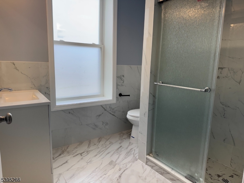 155 Clifton Avenue, Unit 3RR Newark, NJ 07104 - Photo 6 of 13 a bathroom with a sink and a toilet