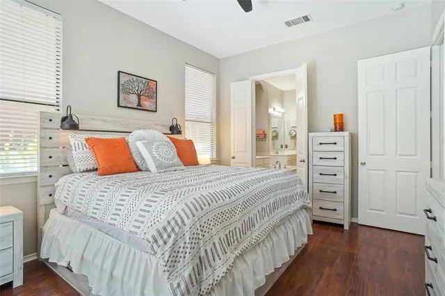 a bedroom with a bed and a dresser