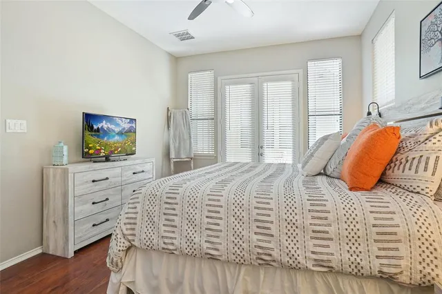 a en suite bathroom with a sink double vanity and a mirror