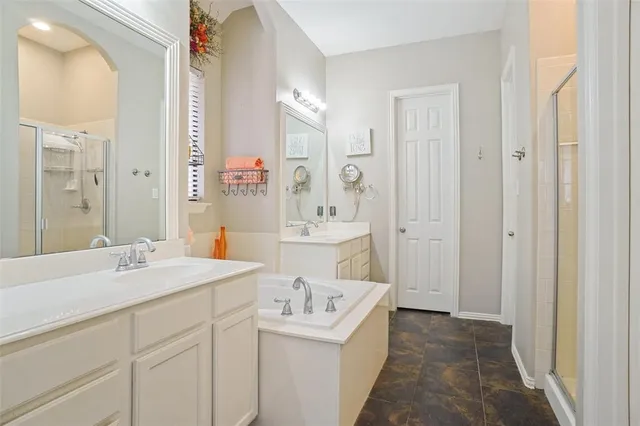 a bathroom with a shower and a glass door
