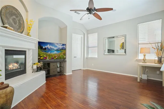a view of a livingroom with furniture and a fireplace