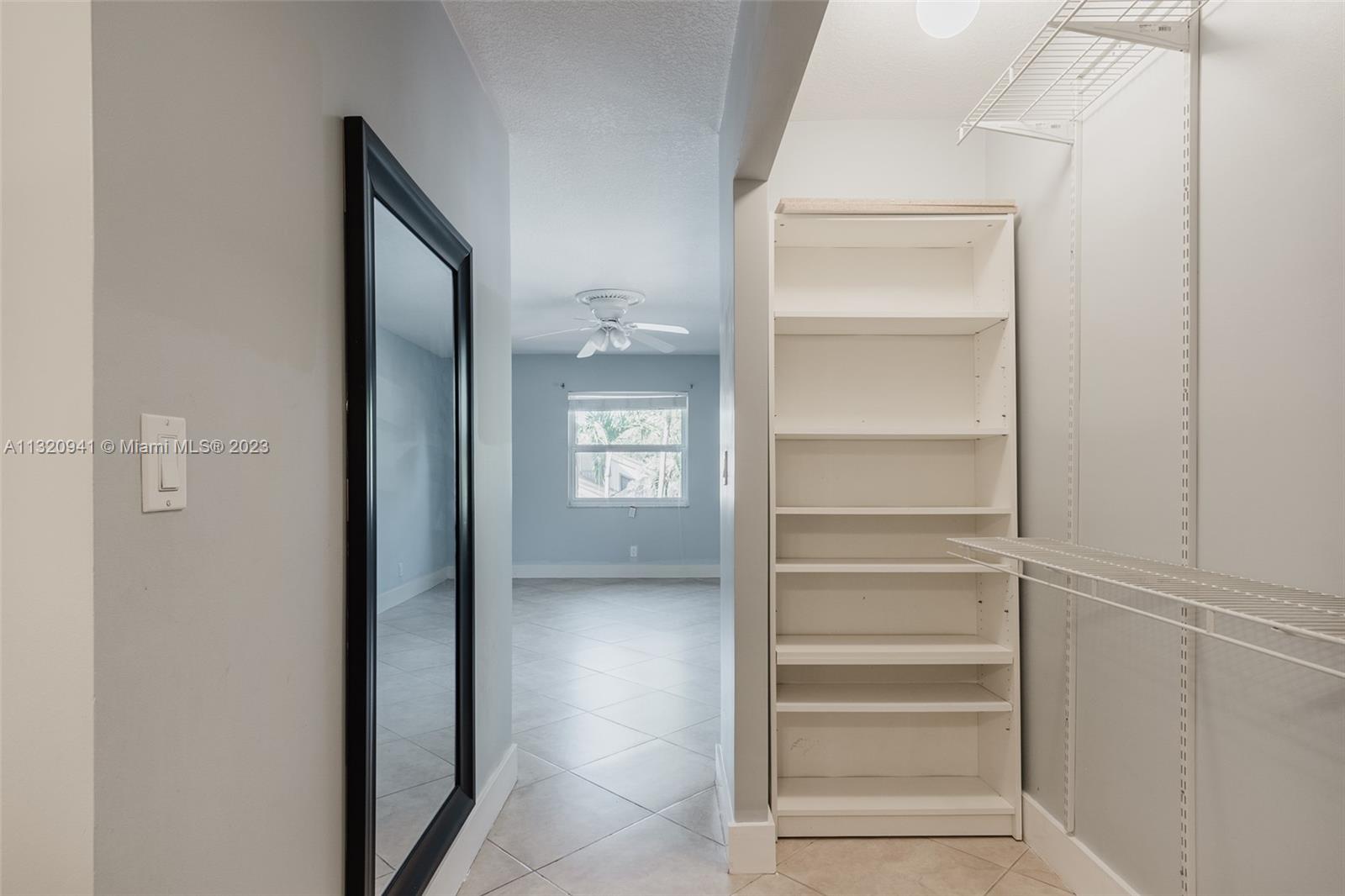 Jacaranda Plantation, FL 33324 - Photo 12 of 22 a view of walk in closet with empty racks