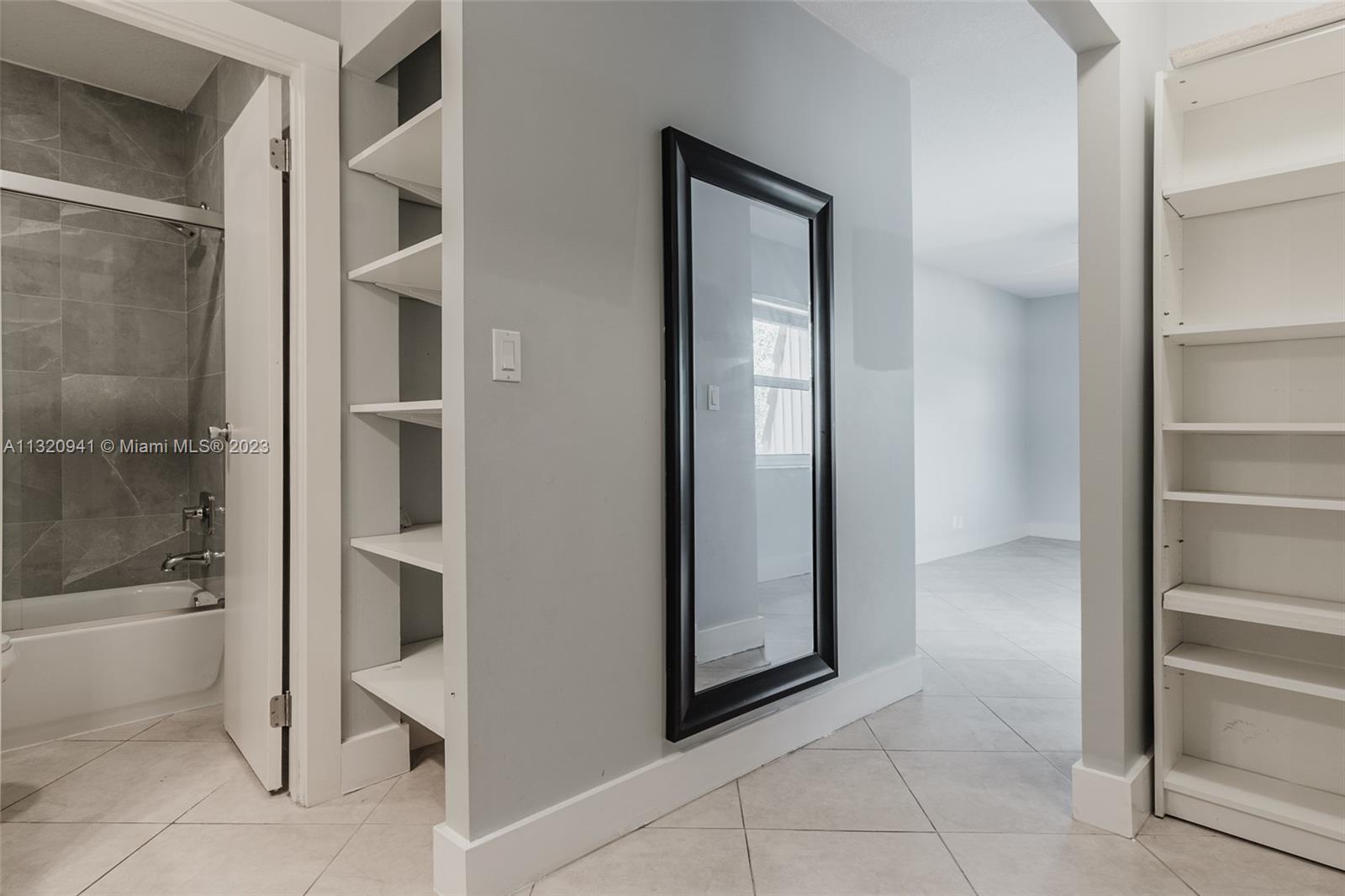 Jacaranda Plantation, FL 33324 - Photo 14 of 22 a view of a bathroom with a glass door
