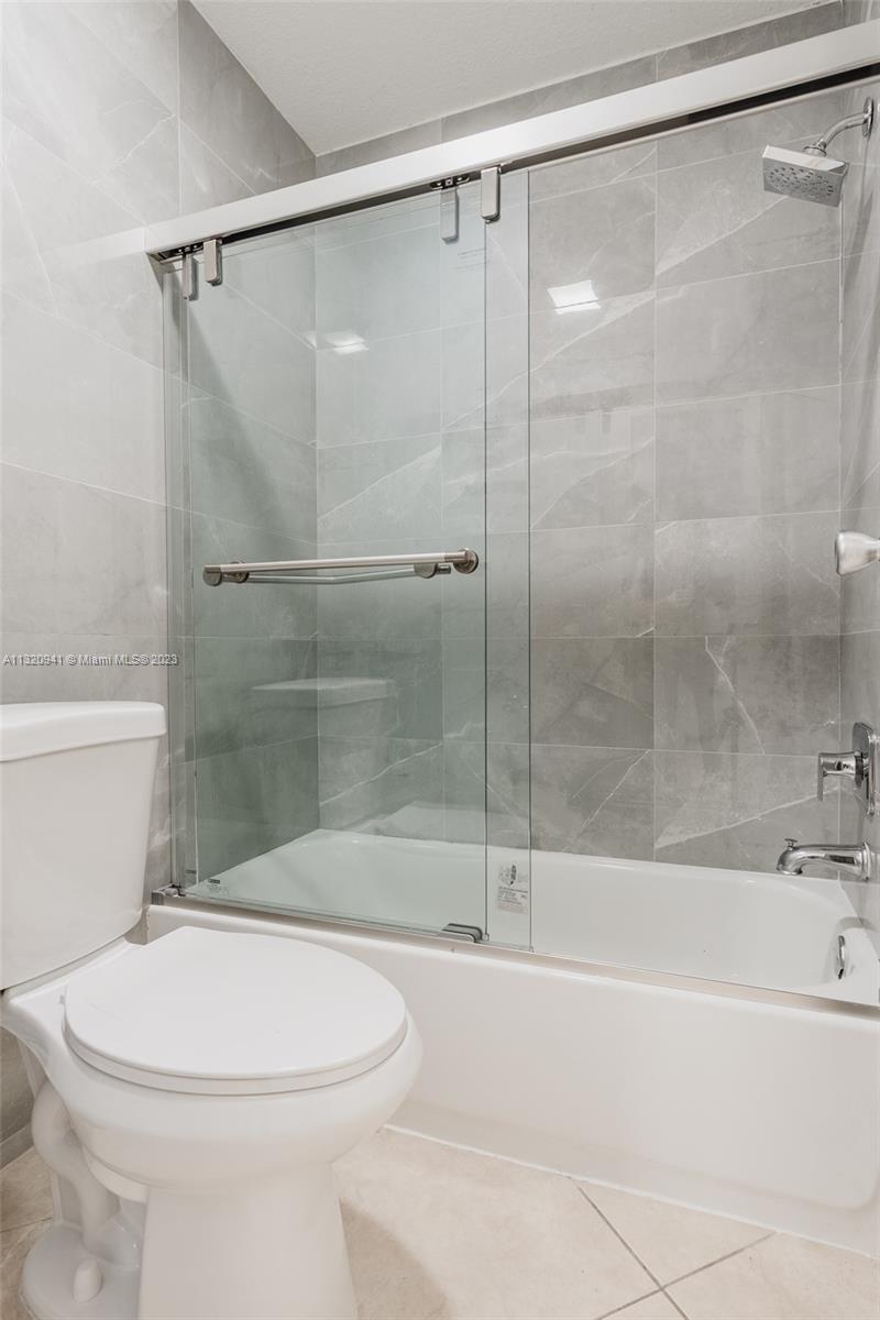 Jacaranda Plantation, FL 33324 - Photo 15 of 22 a bathroom with a bathtub and a shower