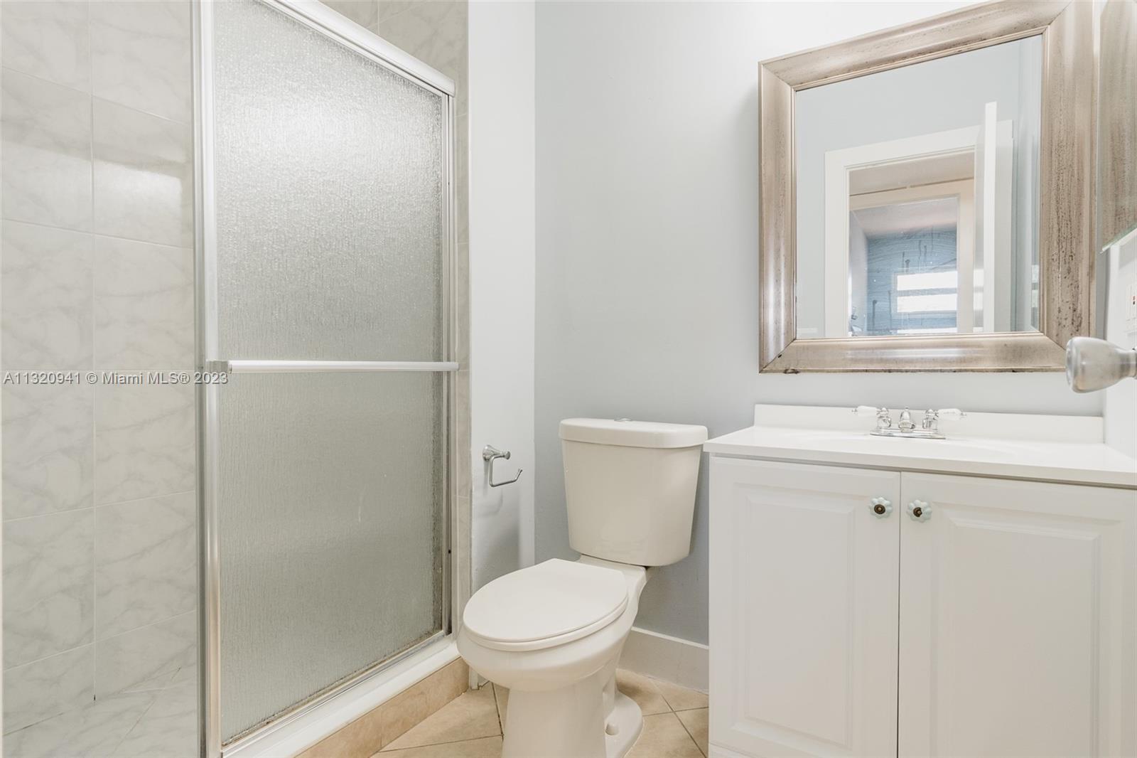 Jacaranda Plantation, FL 33324 - Photo 18 of 22 a bathroom with a sink toilet and shower