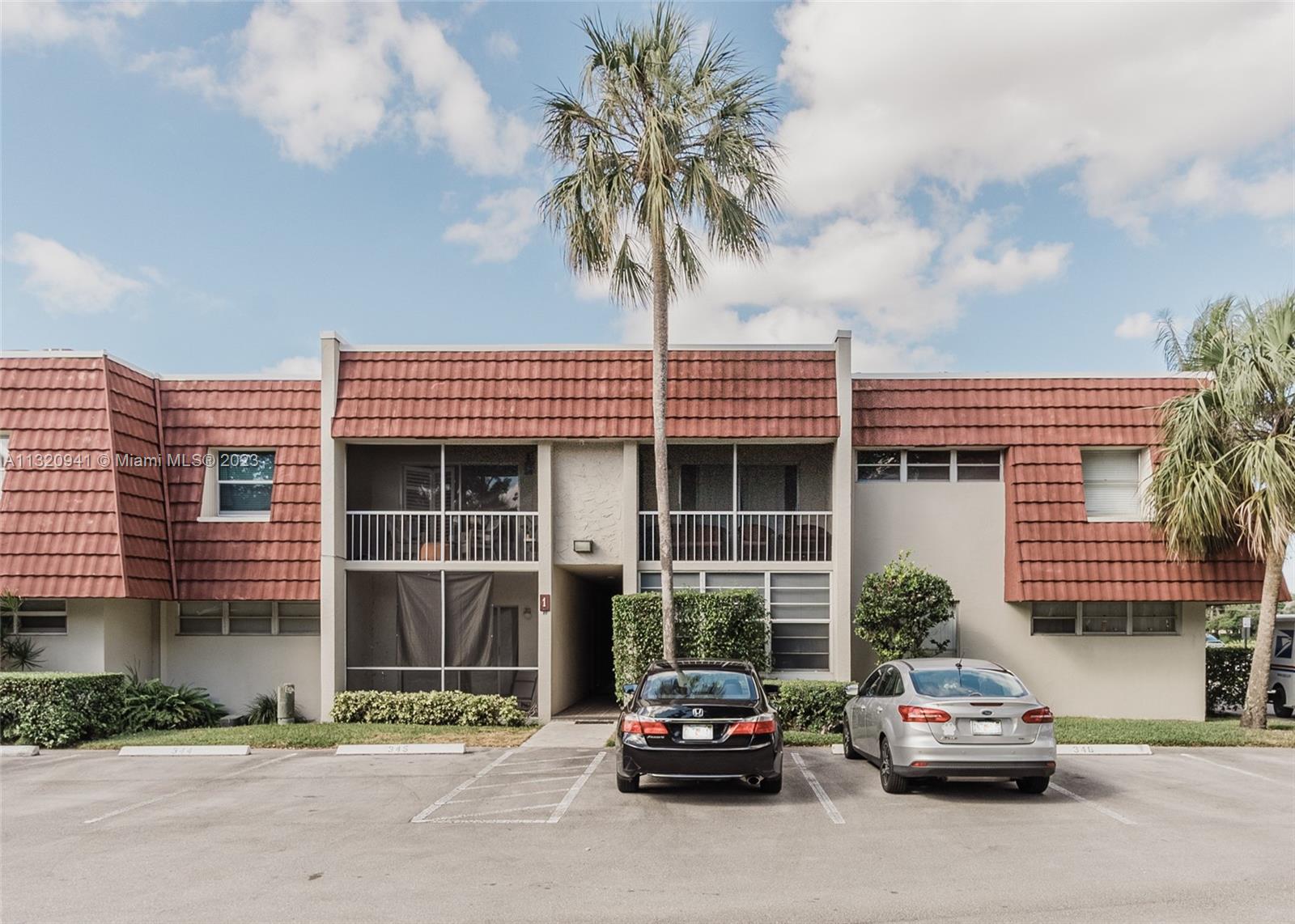 Jacaranda Plantation, FL 33324 - Photo 21 of 22 a car parked in front of a house