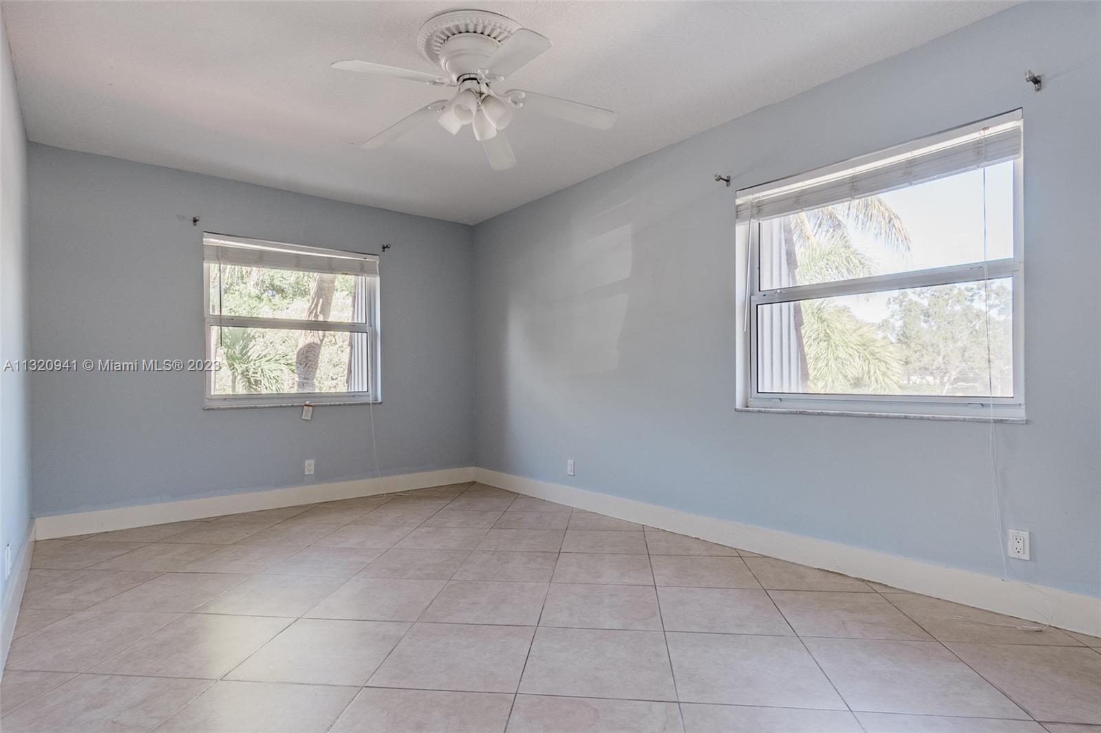 Jacaranda Plantation, FL 33324 - Photo 9 of 22 a view of an empty room with a window