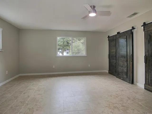 a view of an empty room with a cabinet
