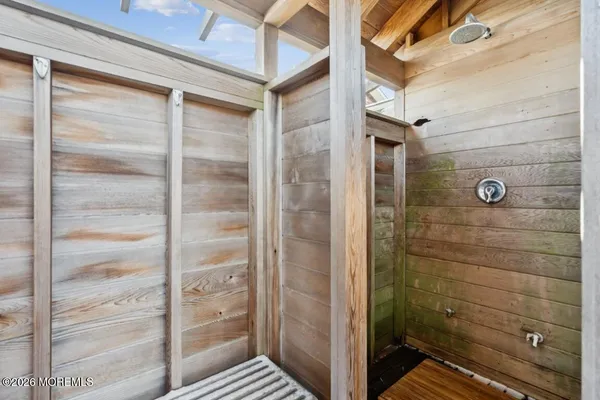 a bathroom with a glass door shower