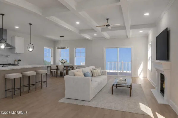 a living room with fireplace furniture and a flat screen tv