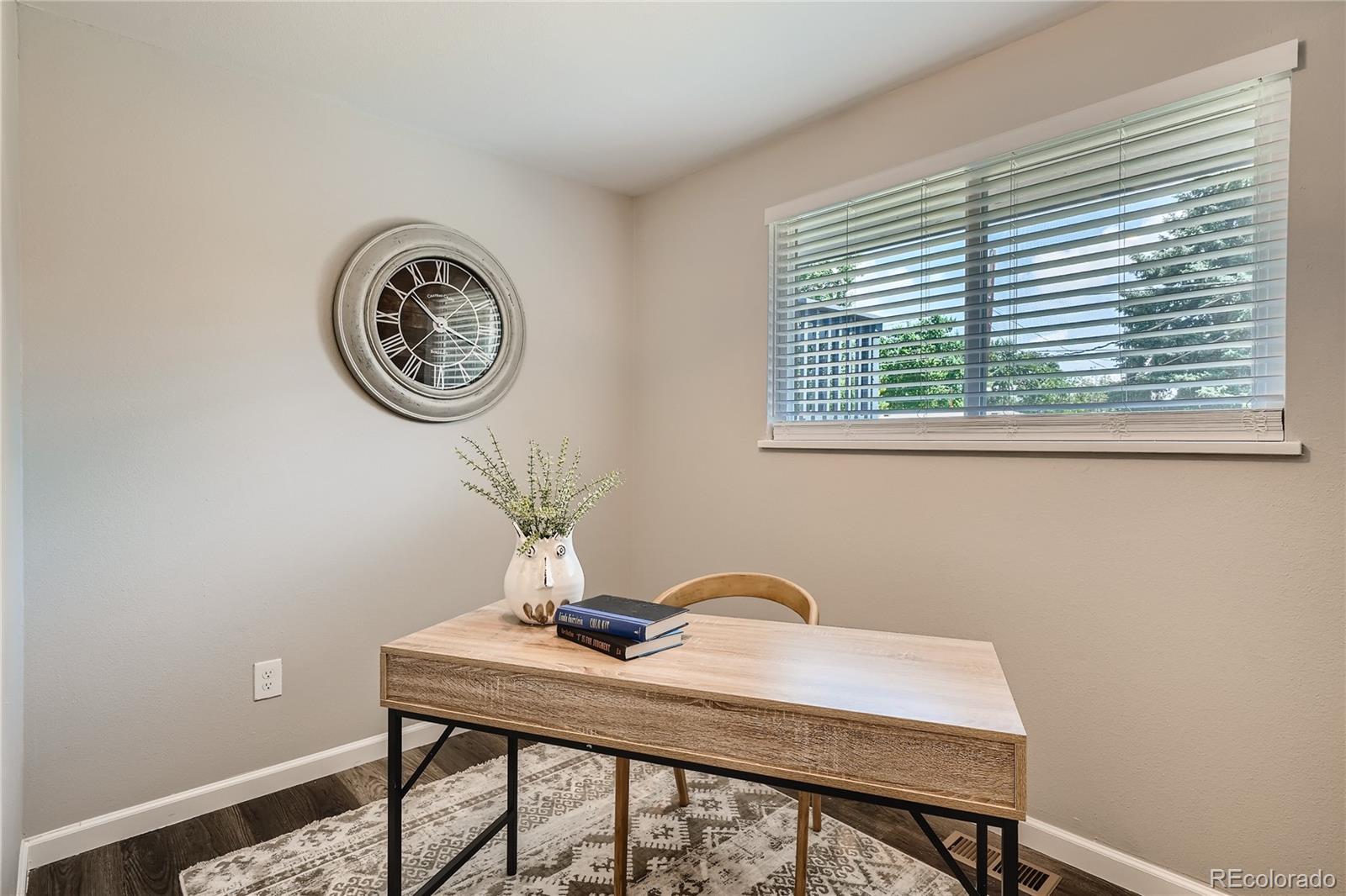 8506 Eaton Street Arvada, CO 80003 - Photo 12 of 28 a view of a workspace with a window